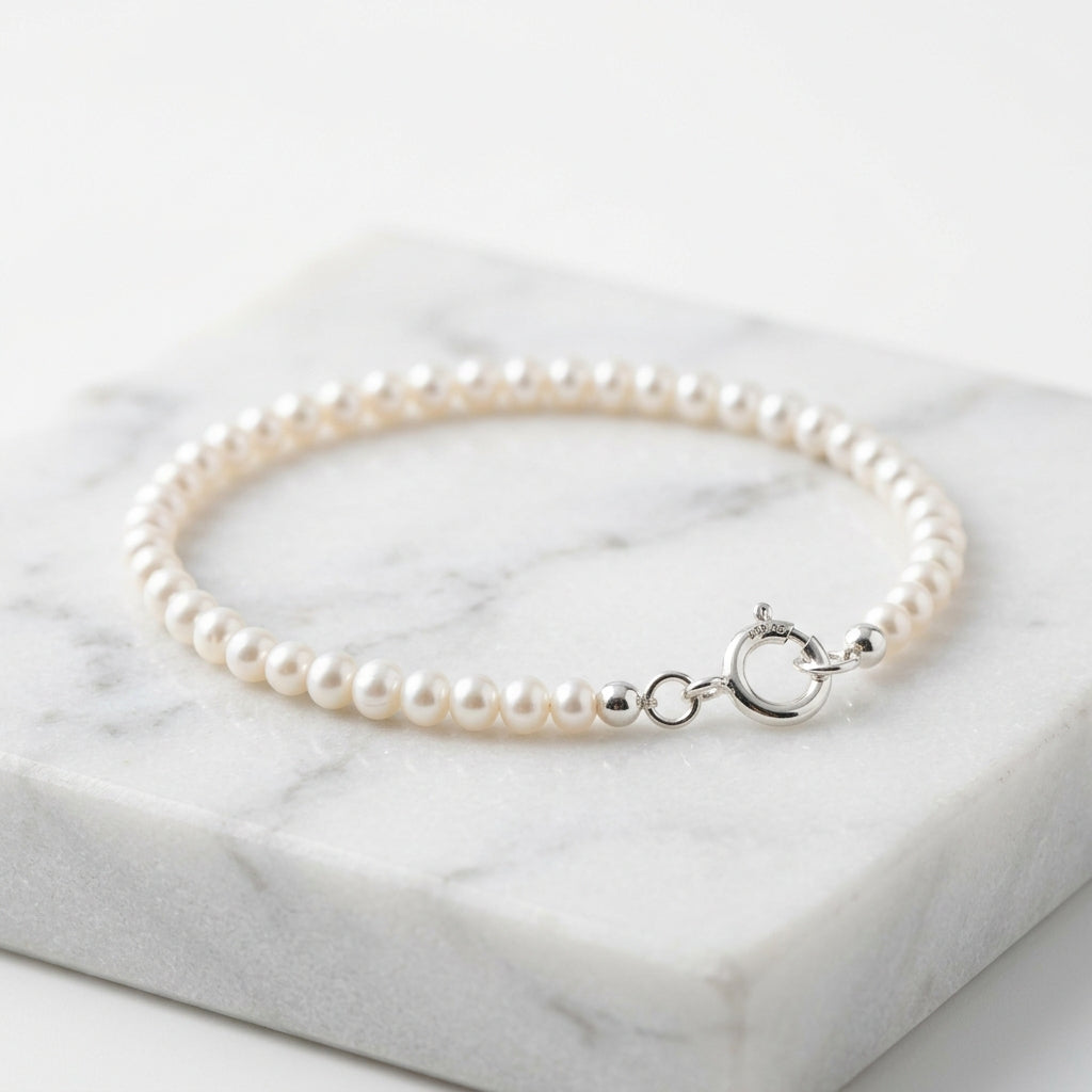 WCJ S999 Sterling Silver Pearl Bracelet main product shot on white marble background