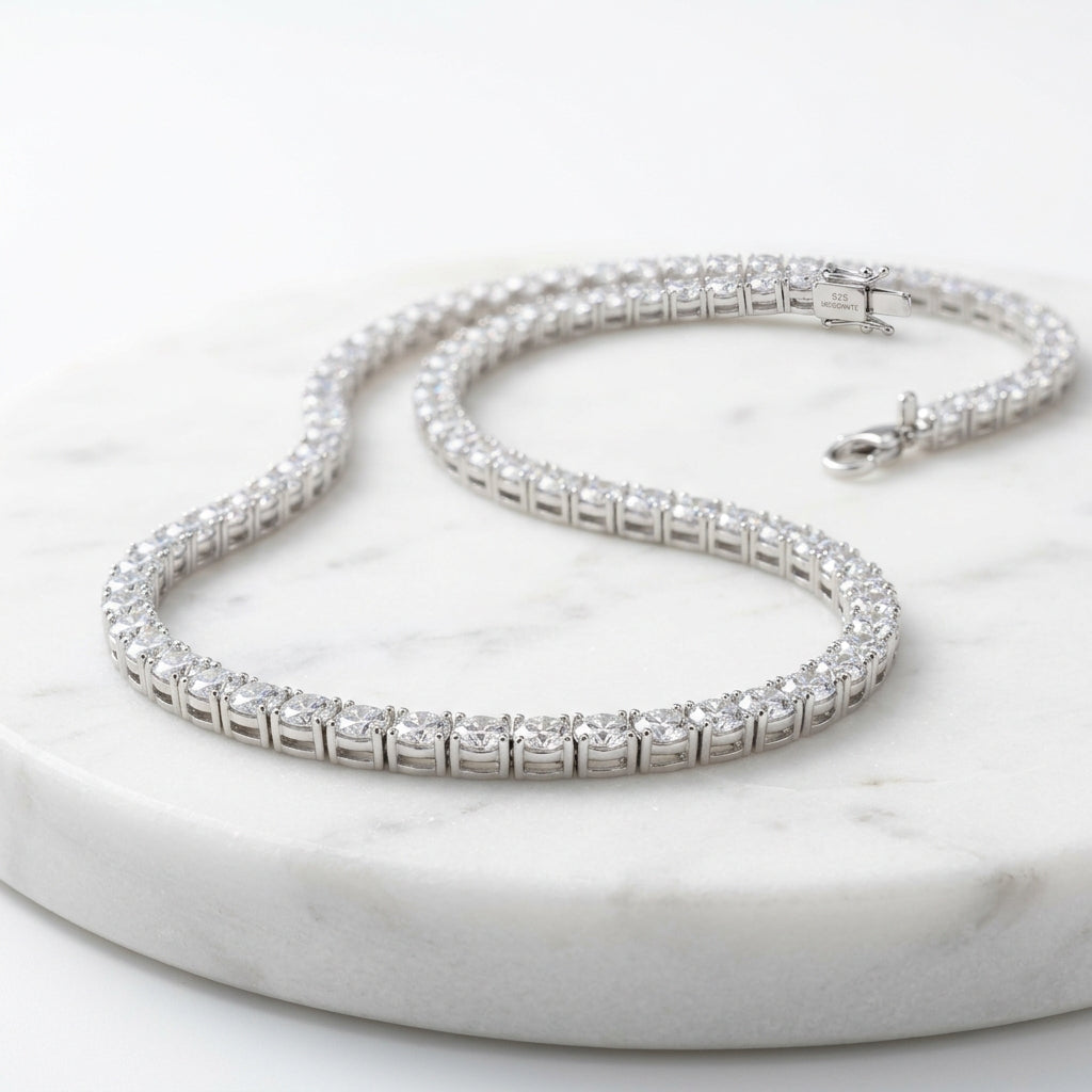 WCJ 925 Sterling Silver Moissanite Tennis Necklace flat lay on marble surface