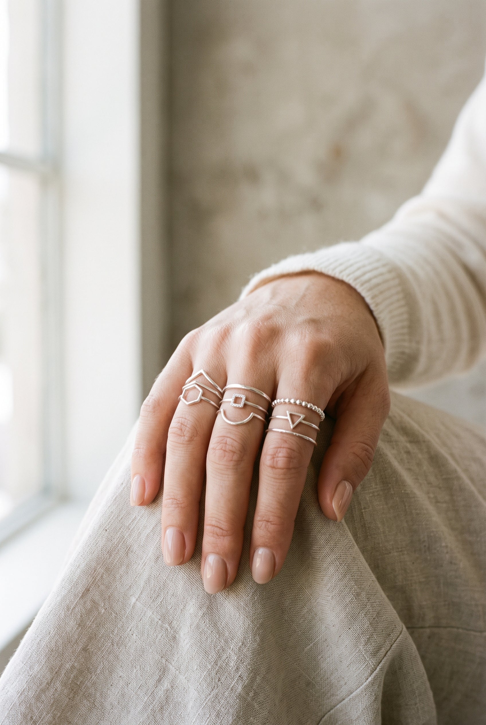 Minimalist hand model wearing WCJ 3-Piece Open Geometric Stacking Rings Set